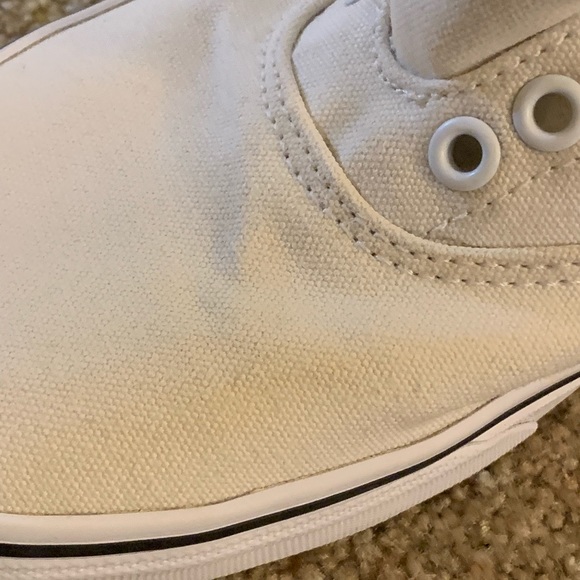 All white Vans with navy blue trim. - Picture 4 of 7